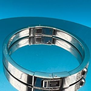 Preowned Michael Kors Astro crystals stainless steel hinged bracelet.